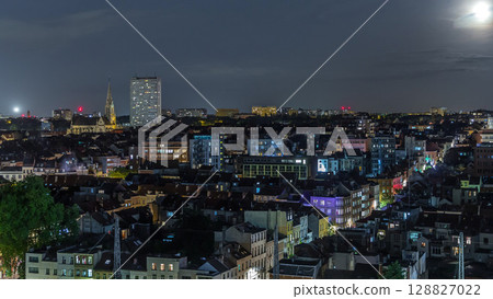 Aerial night timelapse panorama over Brussels skyline in Schaerbeek with Saint-Servais Church 128827022