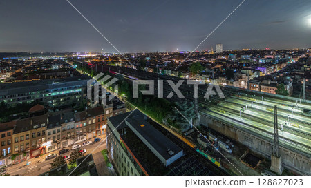 Aerial night timelapse of Brussels North station railway tracks with trains arriving and departing. Belgium Aerial night timelapse of Brussels North station railway tracks with trains arriving and departing. Belgium 128827023