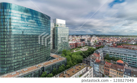 Aerial timelapse of Brussels urban landscape blending office skyscrapers with residential areas. 128827049
