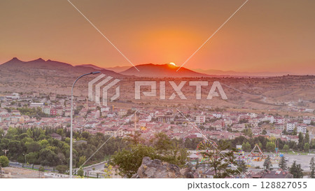 Sunset view from old castle in historical city town of Nevsehir aerial timelapse Sunset view from old castle in historical city town of Nevsehir aerial timelapse 128827055