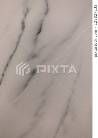 Elegant marble surface with subtle veining showcasing natural beauty and texture for interior design Elegant marble surface with subtle veining showcasing natural beauty and texture for interior design 128827132