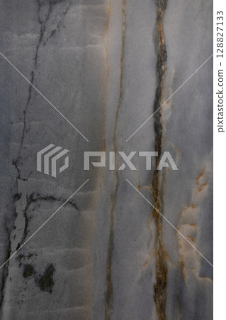 Striking natural marble pattern with veins and textures found in a geological formation during Striking natural marble pattern with veins and textures found in a geological formation during 128827133