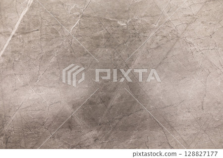 Concrete texture with scratches and markings displayed in neutral tones and soft lighting Concrete texture with scratches and markings displayed in neutral tones and soft lighting 128827177