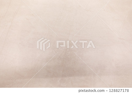 Unique textured surface with subtle light shadows highlighting intricate patterns in a minimalist Unique textured surface with subtle light shadows highlighting intricate patterns in a minimalist 128827178