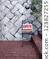Open sign at the entrance of the restaurant 128827255