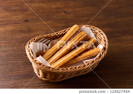 Churros in a basket Churros in a basket 128827484