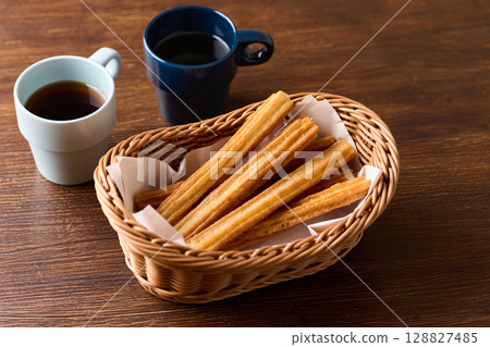 Churros in a basket Churros in a basket 128827485