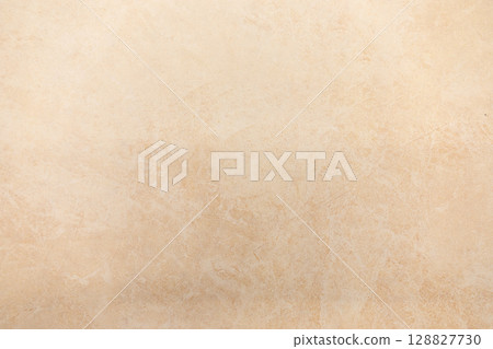 Neutral textured surface in light beige hue suitable for backgrounds and designs Neutral textured surface in light beige hue suitable for backgrounds and designs 128827730