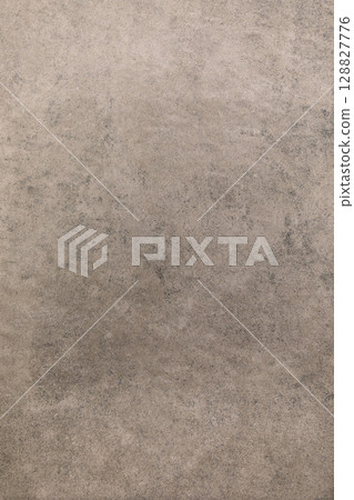 Textured gray surface showcasing subtle variations in tone, ideal for background or design accents Textured gray surface showcasing subtle variations in tone, ideal for background or design accents 128827776