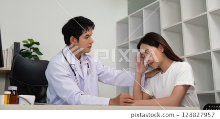 Healthcare. Doctor providing emotional support to distressed patient. Healthcare. Doctor providing emotional support to distressed patient. 128827957