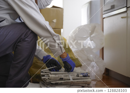 Hands of a man sorting recyclable waste Hands of a man sorting recyclable waste 128828103