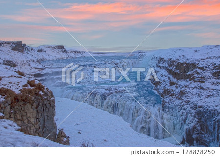 Gullfoss waterfall at colorful sunset in winter 128828250