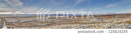 Snowy road leading to Hverfjall area in Iceland 128828285