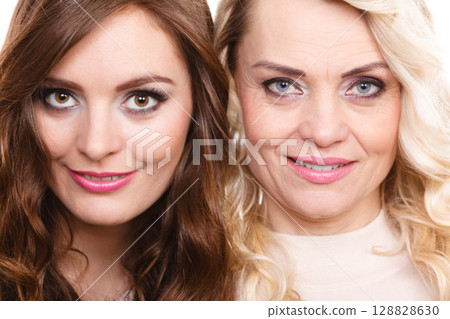Adult mother and daughter portrait 128828630