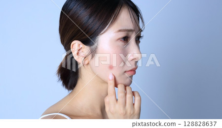 Acne, image of a woman suffering from rough skin Acne, image of a woman suffering from rough skin 128828637