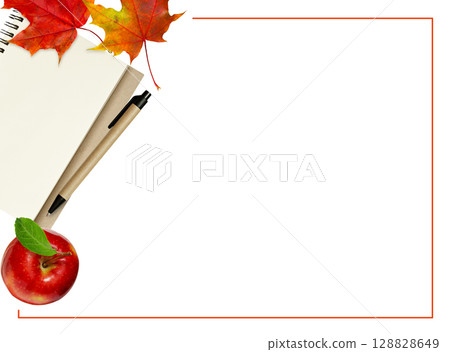 Empty notebook page, red apple, pen and autumn leaves in a corner arrangement with frame isolated on white. Top view. Flat lay. School concept. 128828649