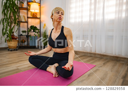 Mindful meditation in a calming indoor space Mindful meditation in a calming indoor space 128829358