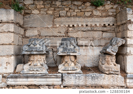 Ancient Corinthian Capitals and Stone Fragments at Ephesus Archaeological Site, Selcuk, Turkey Ancient Corinthian Capitals and Stone Fragments at Ephesus Archaeological Site, Selcuk, Turkey 128830184