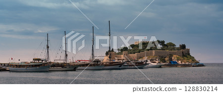Pigeon Island Castle and Traditional Gulets in Kusadasi Harbor, Turkey Pigeon Island Castle and Traditional Gulets in Kusadasi Harbor, Turkey 128830214