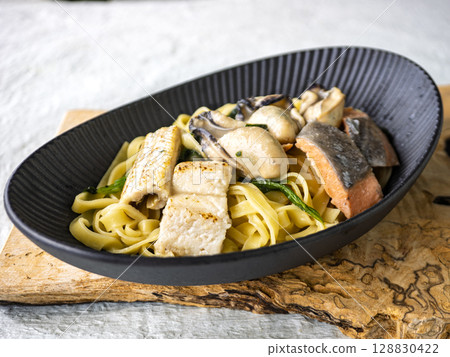Conger eel and oyster feast pasta 128830422