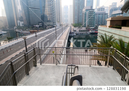 Dubai, UAE - September 29, 2024 Transport interchange in the city, organization of traffic of cars and pedestrians. Editorial Dubai, UAE - September 29, 2024 Transport interchange in the city, organization of traffic of cars and pedestrians. Editorial 128831198