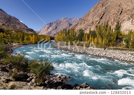 The autumn scenery with Hindu Kush mountain range in the background is very beautiful, Gahkuch,northern Pakistan. The autumn scenery with Hindu Kush mountain range in the background is very beautiful, Gahkuch,northern Pakistan. 128832013