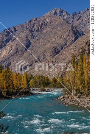 The autumn scenery with Hindu Kush mountain range in the background is very beautiful, Gahkuch,northern Pakistan. 128832023