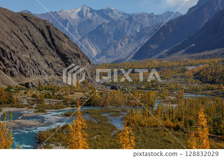 The autumn scenery with Hindu Kush mountain range in the background is very beautiful, Gahkuch,northern Pakistan. 128832029