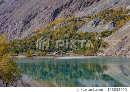 The autumn scenery with Hindu Kush mountain range in the background is very beautiful, Gahkuch,northern Pakistan. 128832033