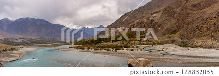 The autumn scenery with Hindu Kush mountain range in the background is very beautiful, Gahkuch,northern Pakistan. 128832035
