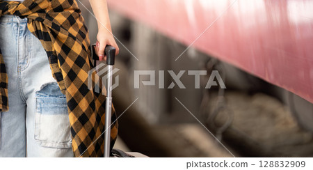 Couple waiting at train station with luggage, ready for adventure 128832909