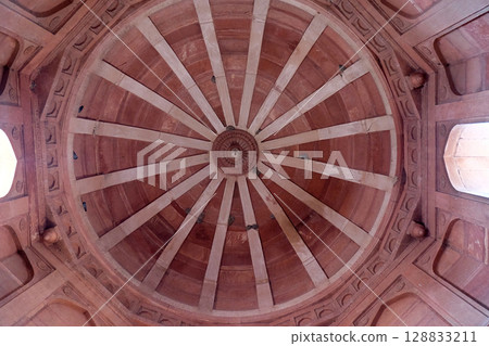 Beautiful stone carvings on the wall in Fatehpur Sikri complex, Uttar Pradesh, India 128833211