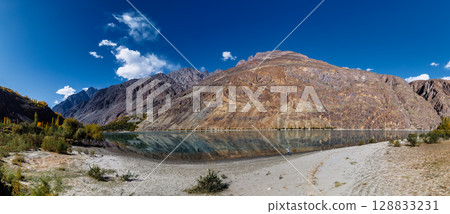The autumn scenery with Hindu Kush mountain range in the background is very beautiful, Gahkuch,northern Pakistan. The autumn scenery with Hindu Kush mountain range in the background is very beautiful, Gahkuch,northern Pakistan. 128833231