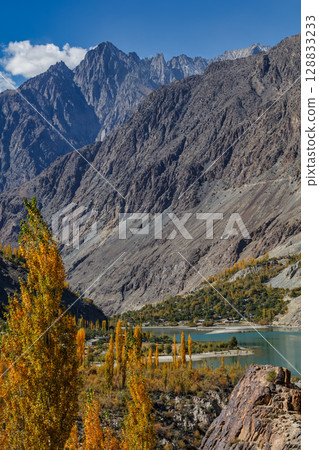 The autumn scenery with Hindu Kush mountain range in the background is very beautiful, Gahkuch,northern Pakistan. 128833233