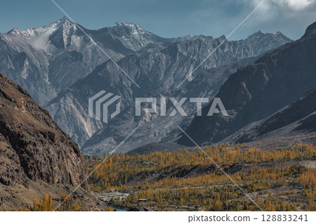 The autumn scenery with Hindu Kush mountain range in the background is very beautiful, Gahkuch,northern Pakistan. The autumn scenery with Hindu Kush mountain range in the background is very beautiful, Gahkuch,northern Pakistan. 128833241