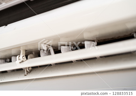 Mold on air conditioner close-up. Air conditioner maintenance and cleaning. 128833515