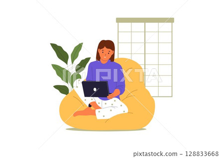 Freelance Woman Working on Laptop in Cozy Home Office with Bean Bag 128833668
