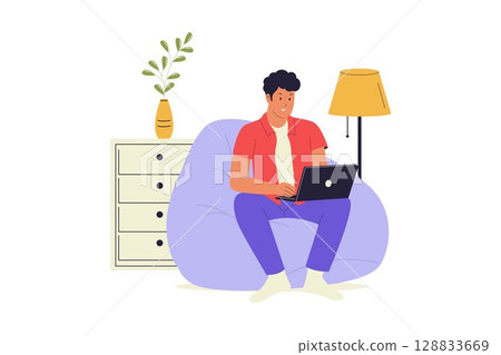 Man Working from Home on Bean Bag Chair Man Working from Home on Bean Bag Chair 128833669
