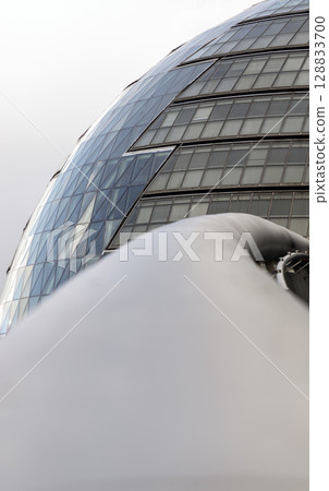 Perspective of stainless steel handrail with City Hall in the background. Perspective of stainless steel handrail with City Hall in the background. 128833700
