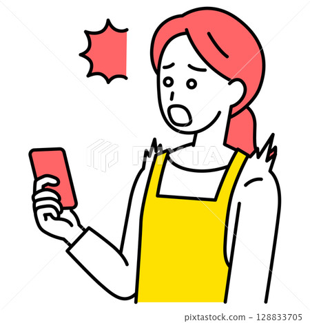A woman in an apron is surprised at the screen of her smartphone 128833705