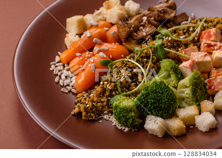 Food bowl with tofu, quinoa, broccoli and carrots, microgreens Food bowl with tofu, quinoa, broccoli and carrots, microgreens 128834034