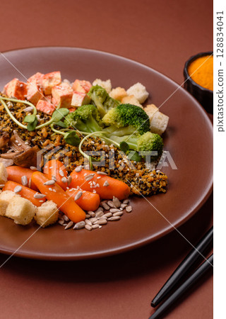 Food bowl with tofu, quinoa, broccoli and carrots, microgreens Food bowl with tofu, quinoa, broccoli and carrots, microgreens 128834041