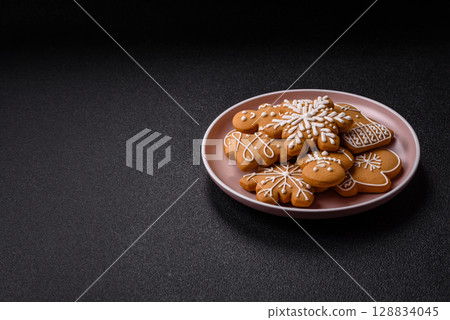 Christmas winter gingerbread, holiday biscuits on monochrome background 128834045