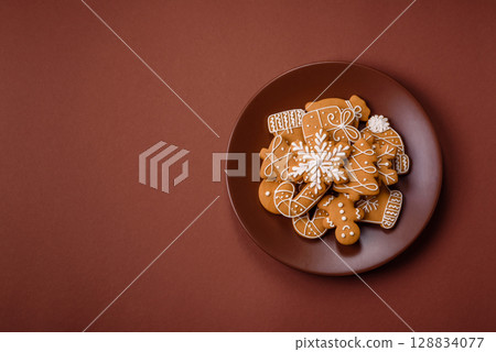 Christmas winter gingerbread, holiday biscuits on monochrome background Christmas winter gingerbread, holiday biscuits on monochrome background 128834077