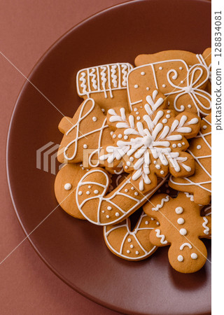 Christmas winter gingerbread, holiday biscuits on monochrome background 128834081