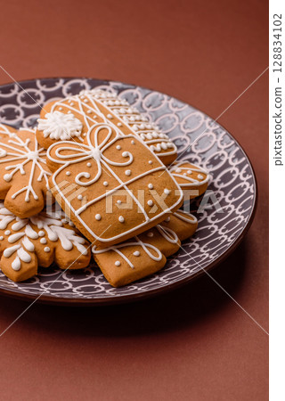 Christmas winter gingerbread, holiday biscuits on monochrome background Christmas winter gingerbread, holiday biscuits on monochrome background 128834102