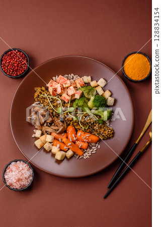 Food bowl with tofu, quinoa, broccoli and carrots, microgreens Food bowl with tofu, quinoa, broccoli and carrots, microgreens 128834154