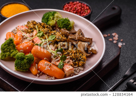 Food bowl with tofu, quinoa, broccoli and carrots, microgreens 128834164