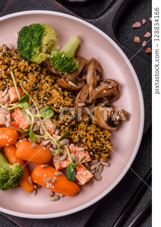 Food bowl with tofu, quinoa, broccoli and carrots, microgreens 128834166