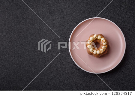 Round chocolate tart or pie with cream berry filling 128834517